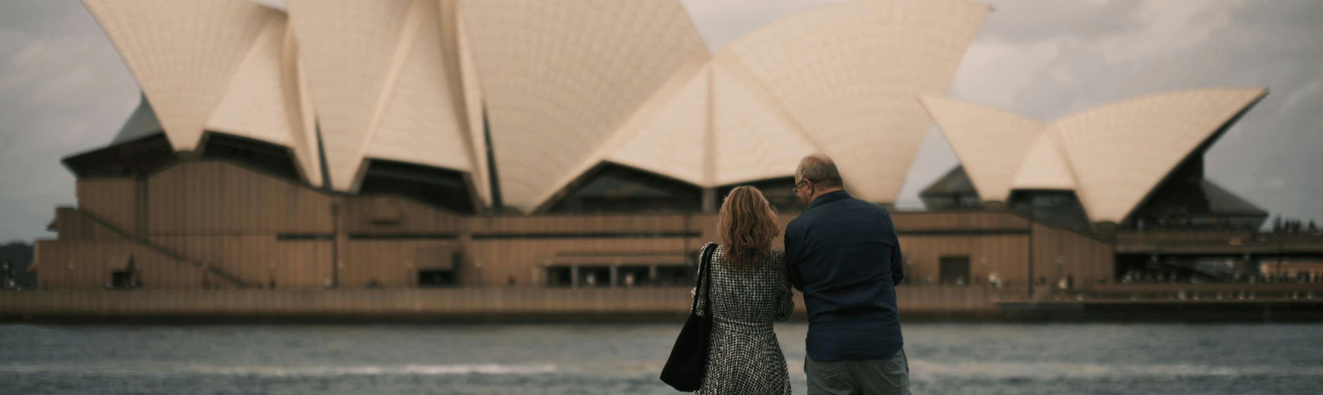 people looking at the sydney opera house