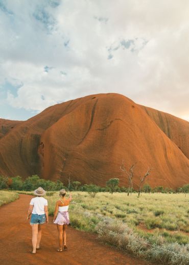 people walking near uluru